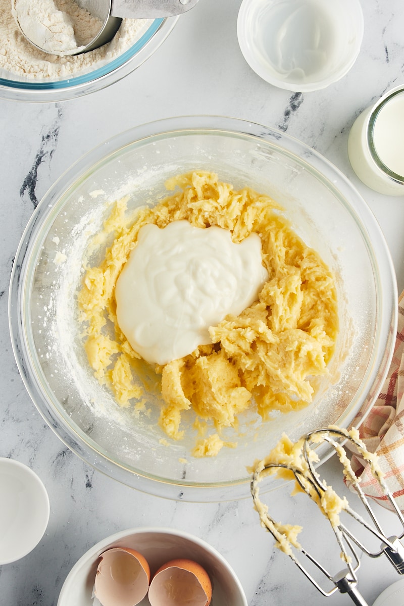 Plain or vanilla yogurt being incorporated into the cake batter.