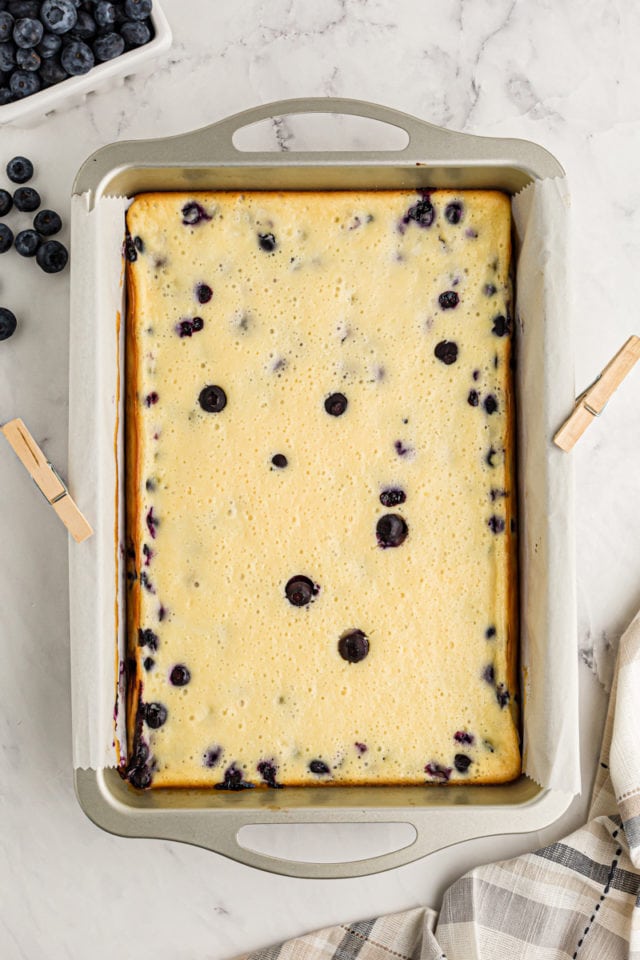 Blueberry oat cheesecake bars in baking pan