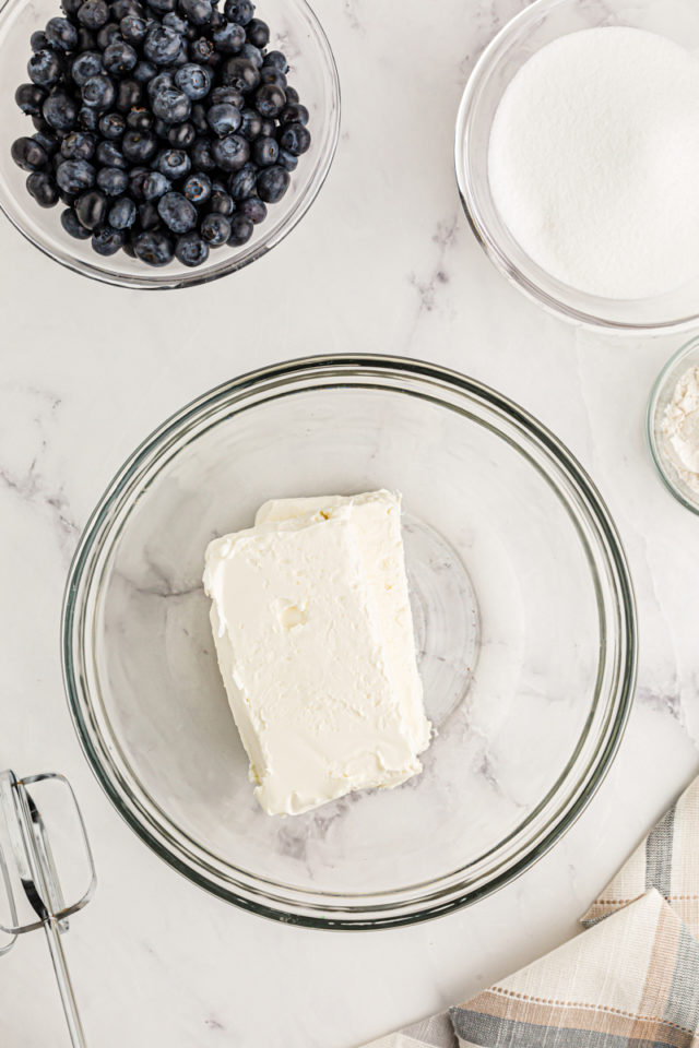 Overhead view of cream cheese bars in glass bowl