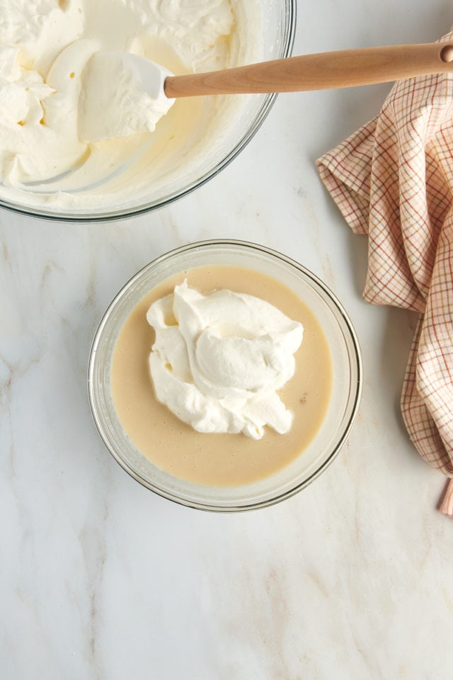 overhead view of whipped cream added to milk mixture for butter pecan ice cream