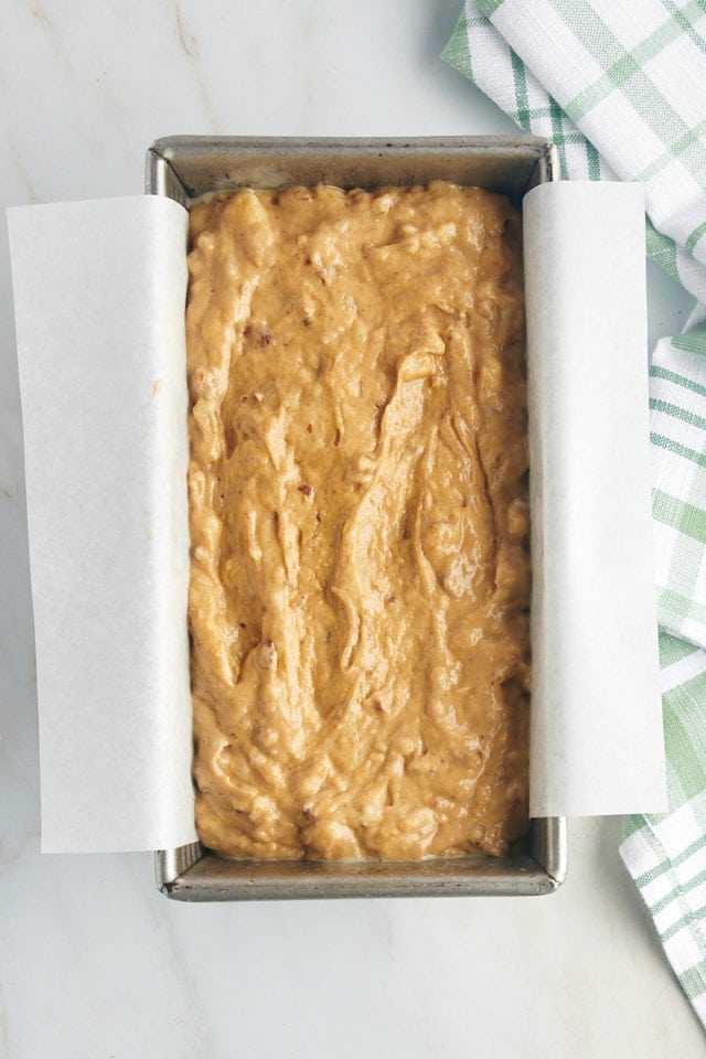 Overhead view of peanut butter banana bread batter in loaf pan