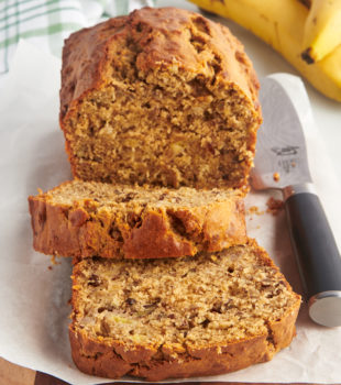 Sliced peanut butter banana bread on cutting board with knife