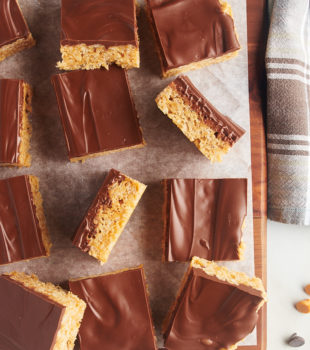 Scotcheroo squares on parchment-lined wooden board