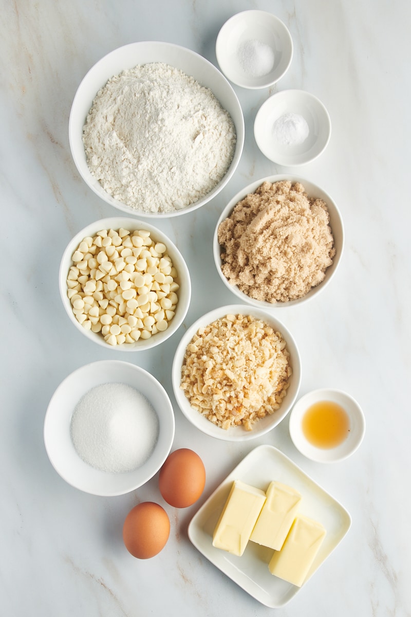 Overhead view of white chocolate macadamia nut cookie ingredients.