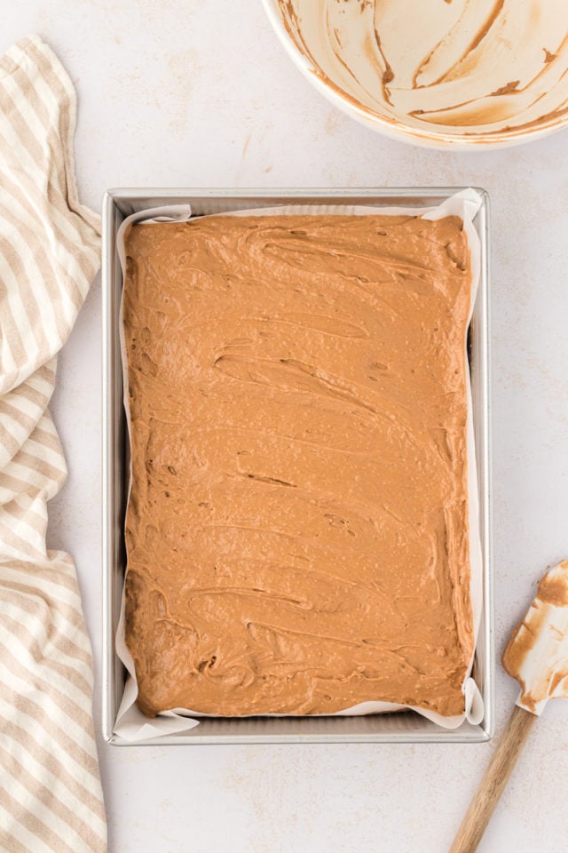 Overhead view of chocolate hazelnut cake batter in pan