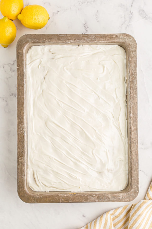 Overhead view of lemon poke cake in pan