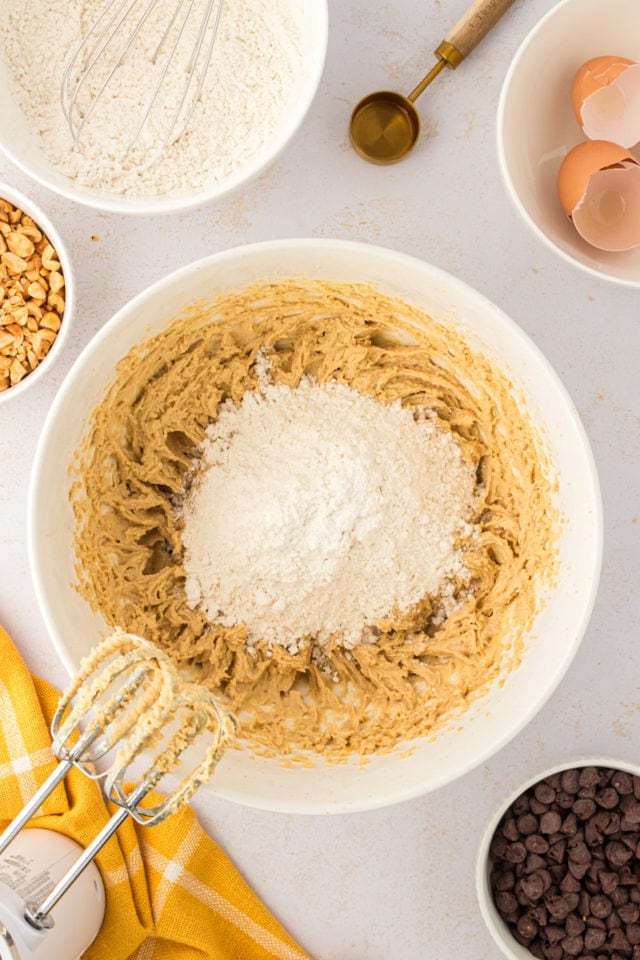 overhead view of dry ingredients added to toffee squares dough