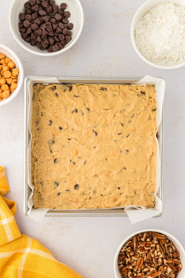 overhead view of toffee squares dough spread in a rectangular baking pan