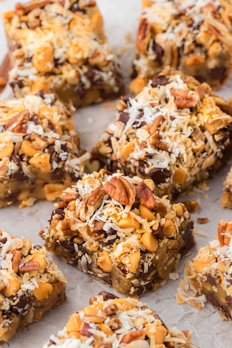 toffee squares scattered on parchment paper