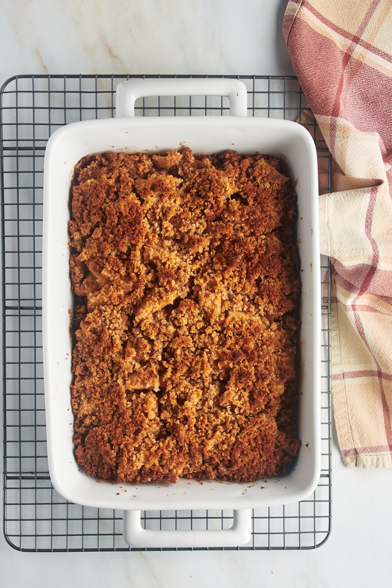 Overhead view of Apple Brown Betty in baking dish on wire rack