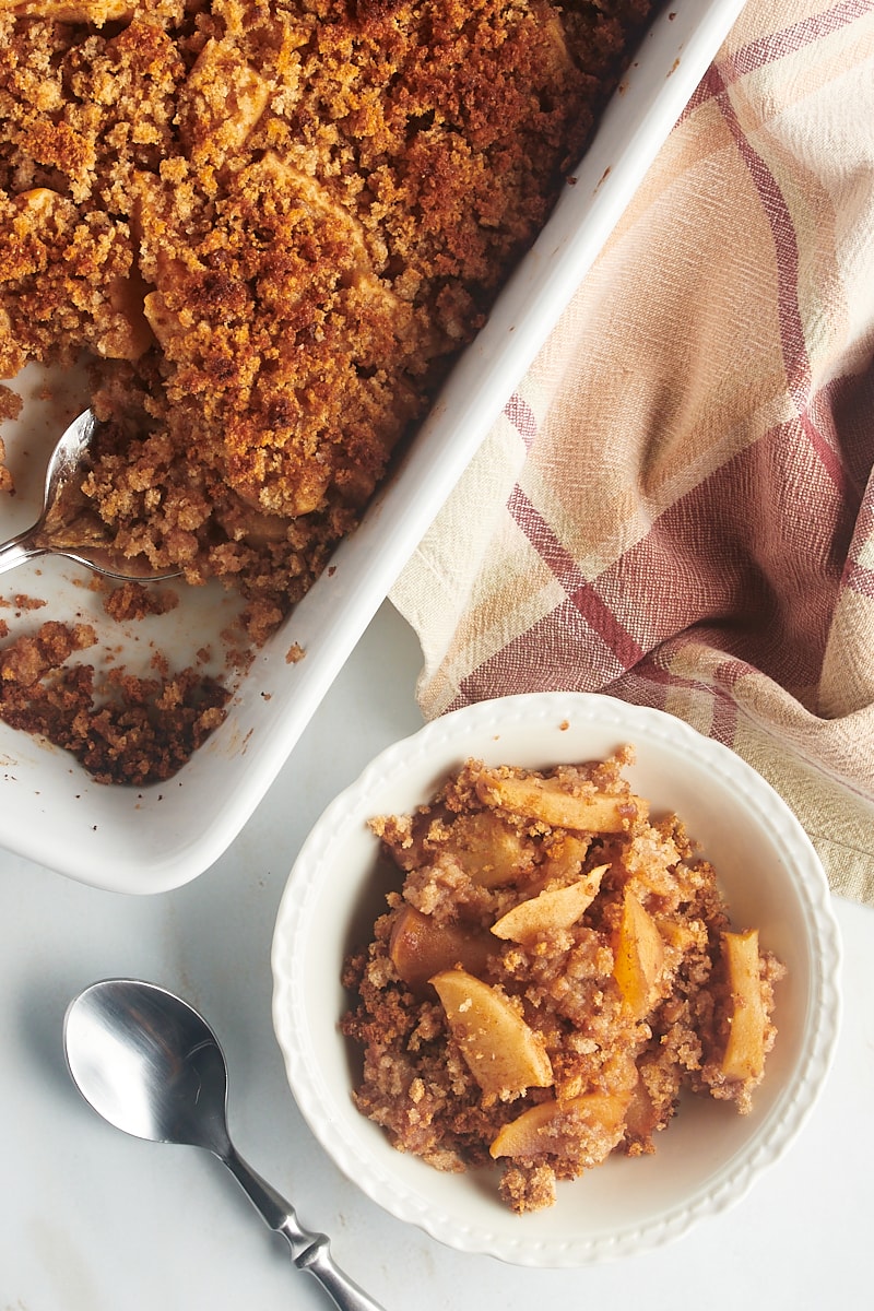 Overhead view of Apple Brown Betty in baking dish and bowl