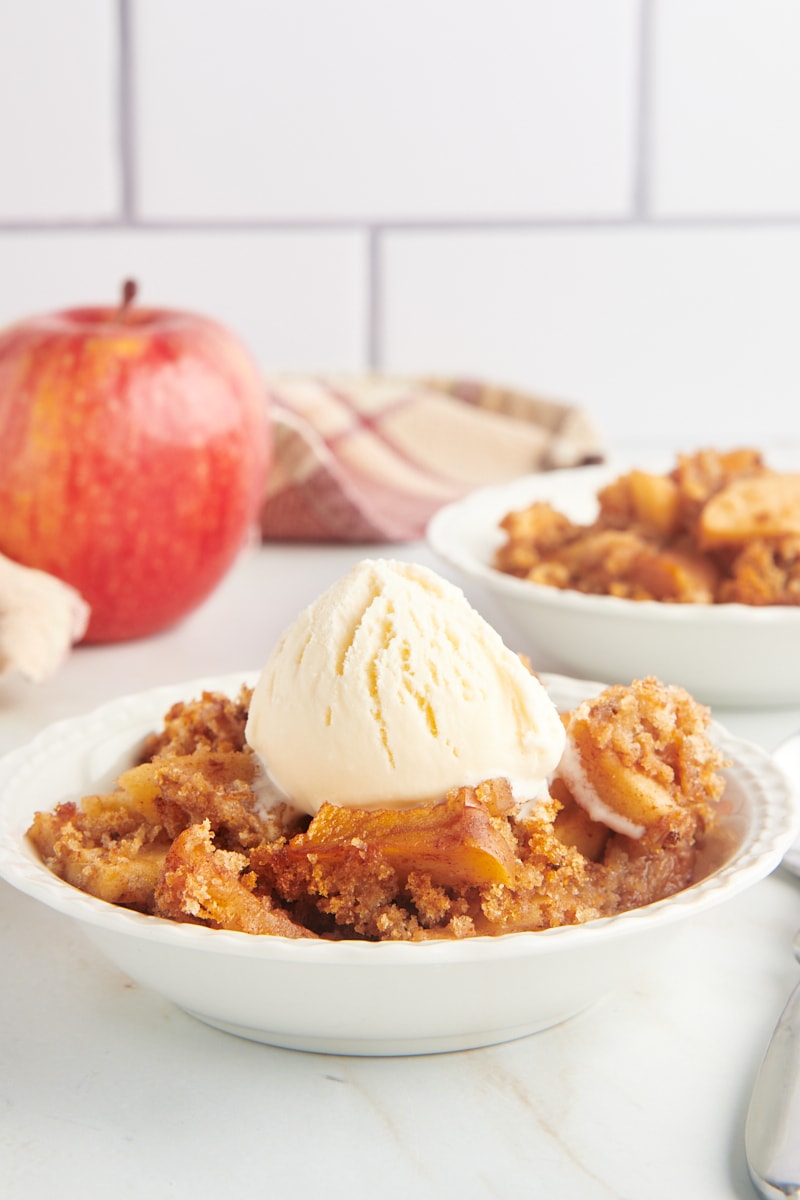 Bowls of Apple Brown Betty with vanilla ice cream on top