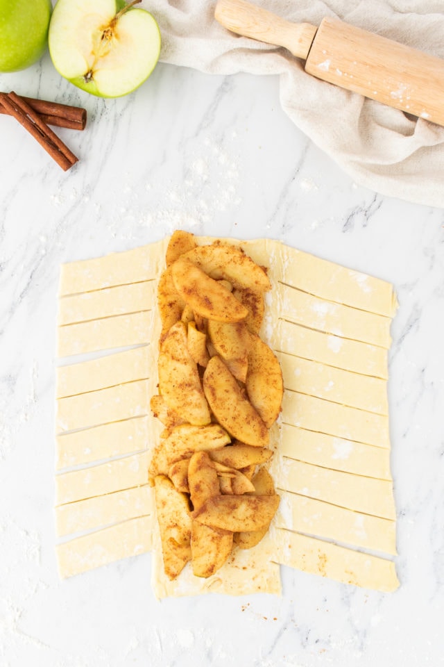 overhead view of apple filling on prepared puff pastry