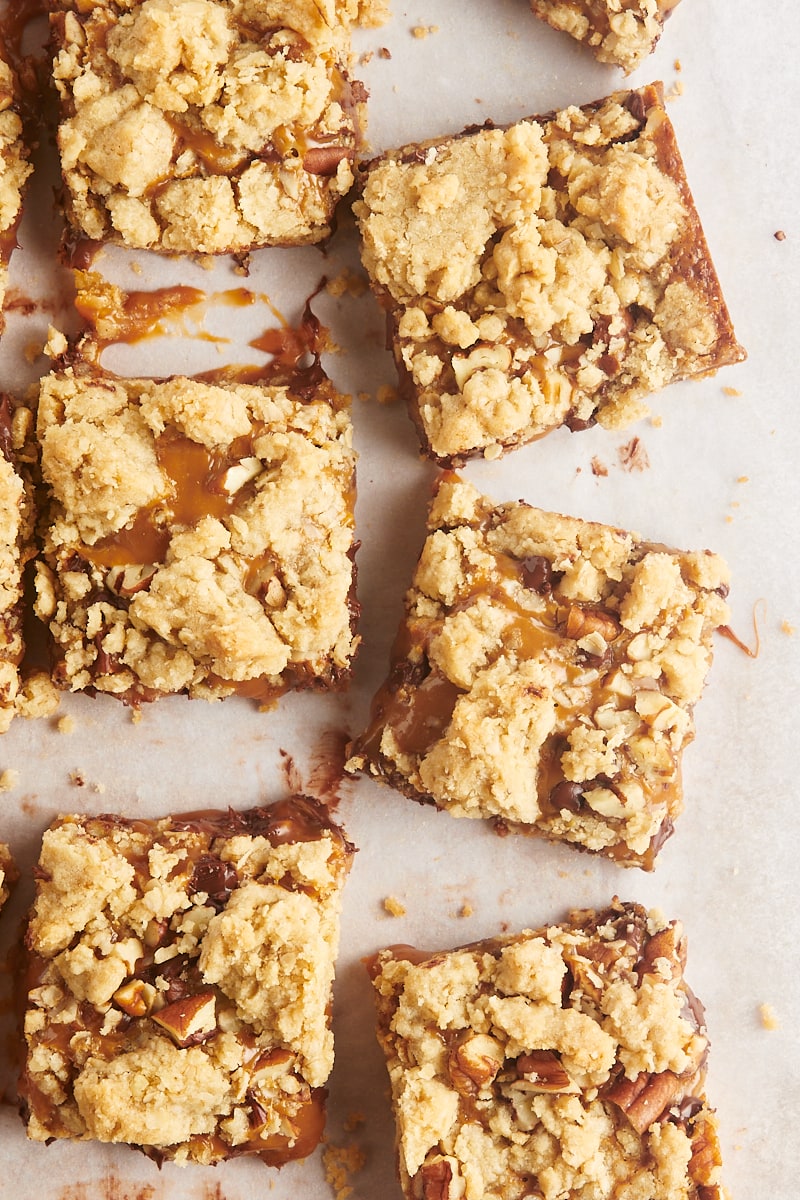 Overhead view of carmelita squares on parchment paper