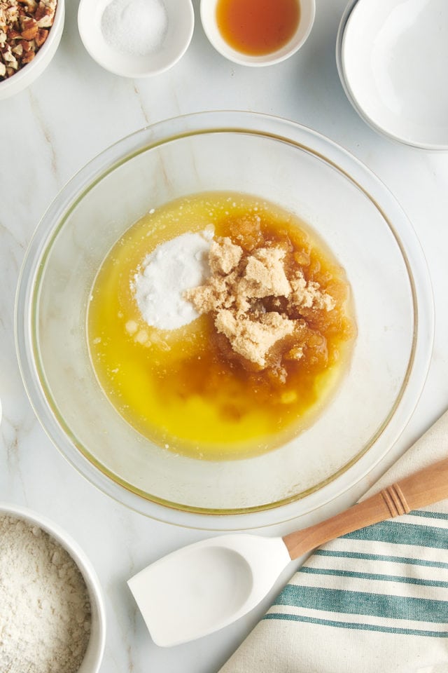 Overhead view of butter and sugar in glass bowl