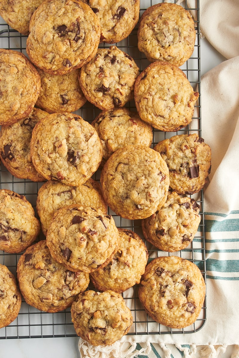 Overhead view of chocolate chunk pecan cookies on wire rack