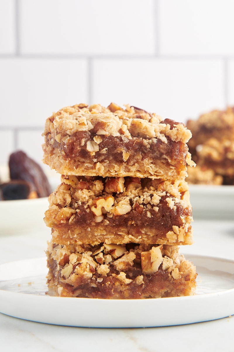 Three date bars stacked on white plate