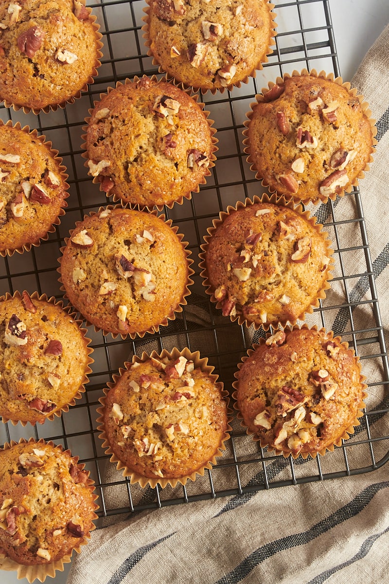 overhead view of date nut muffins on a wire rack