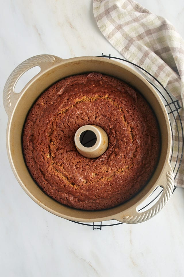 Overhead view of pear bread in pan on wire rack