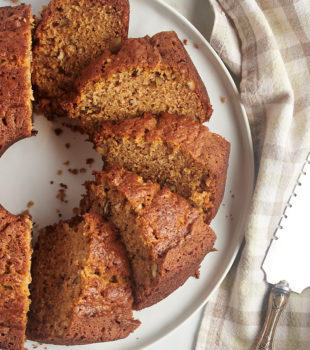 Overhead view of sliced pear bread on round serving tray