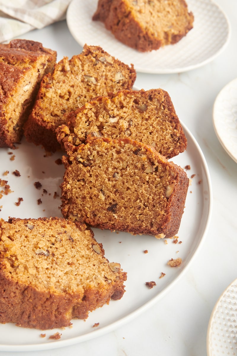 Slices of pear bread arranged on round white serving platter