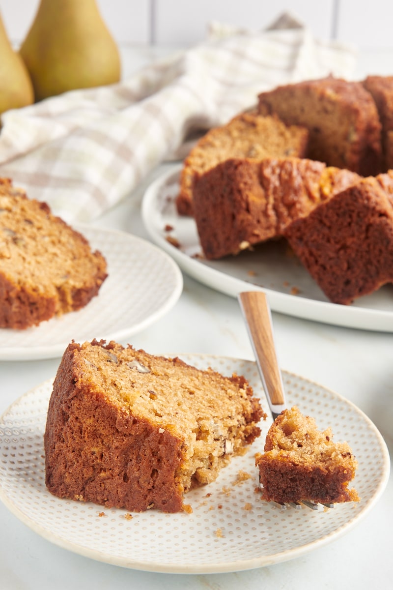 Slices of pear bread on two plates and platter