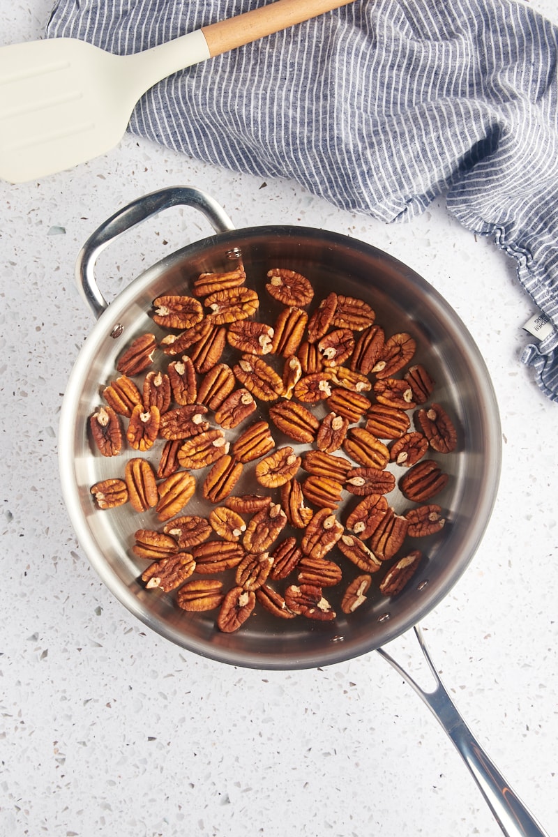 overhead view of pecan halves in a skillet