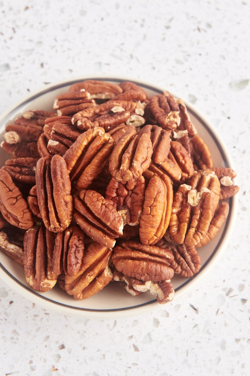 toasted pecans in a shallow bowl