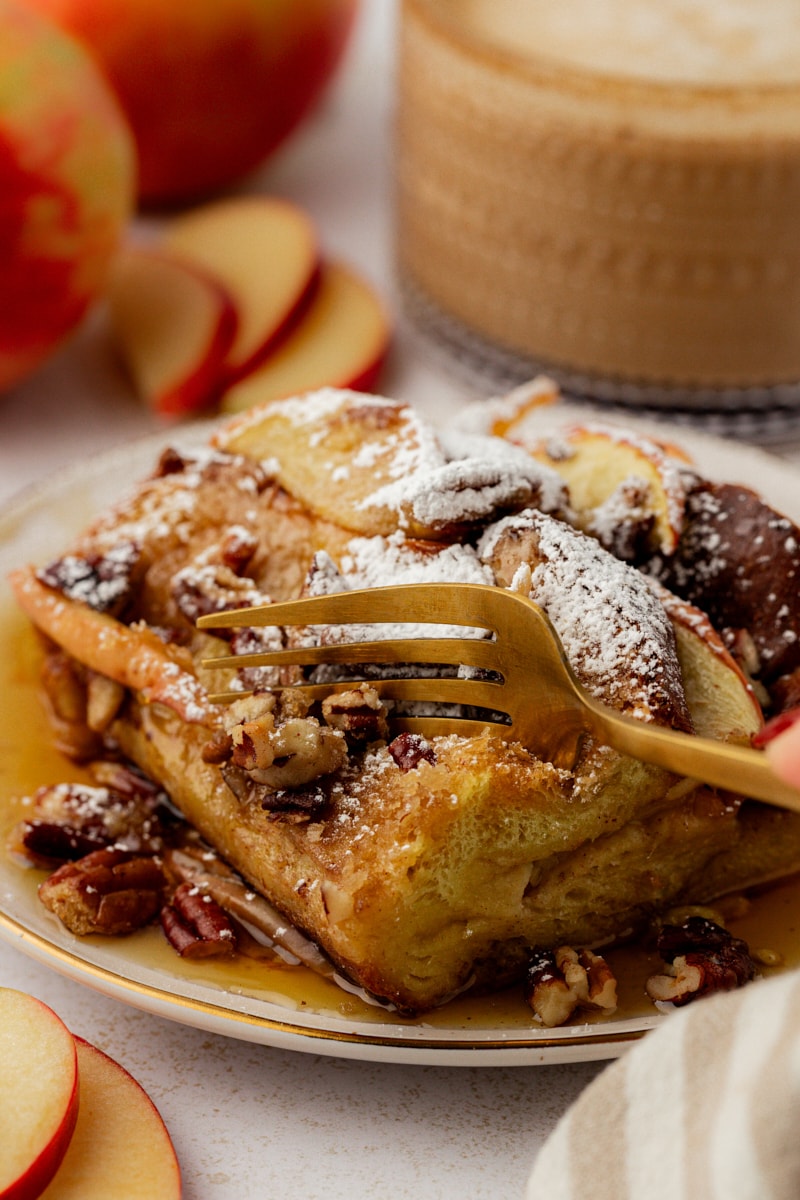 Fork cutting into corner of apple cinnamon French toast