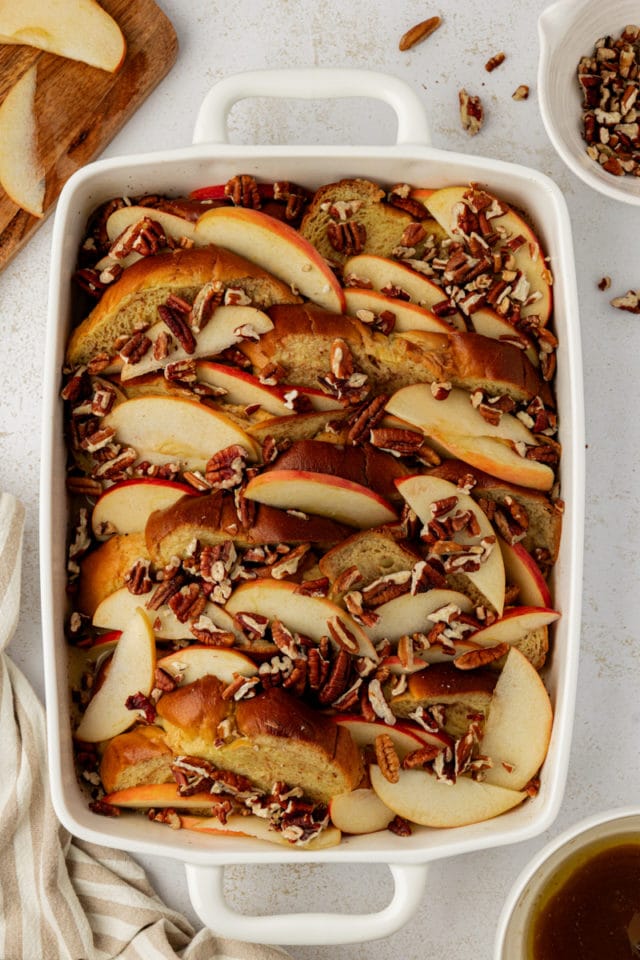 Overhead view of apple cinnamon baked French toast in baking dish before baking