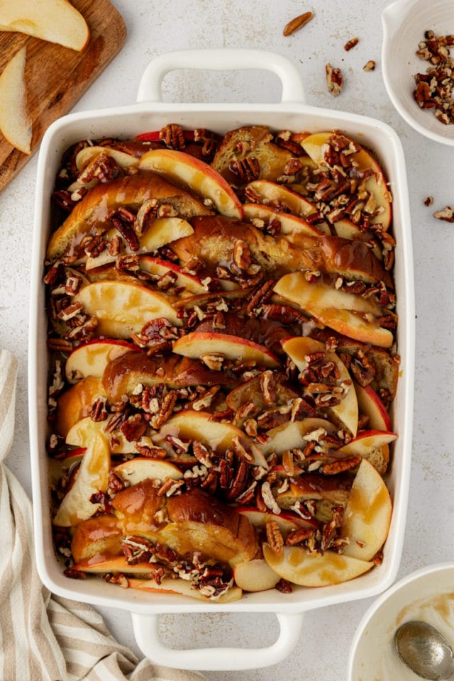 Overhead view of apple cinnamon baked French toast in baking dish before baking