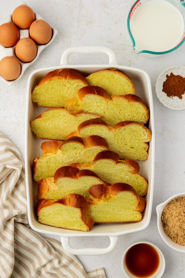 Overhead view of challah slices in baking dish