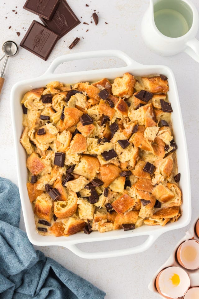 Overhead view of chocolate croissant bread pudding in baking dish before baking