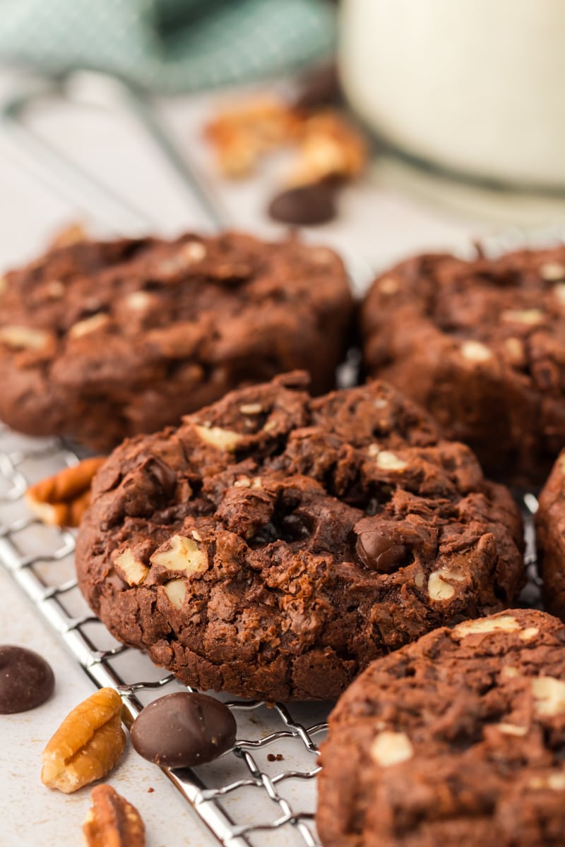 Thick and chewy double chocolate cookies on wire rack