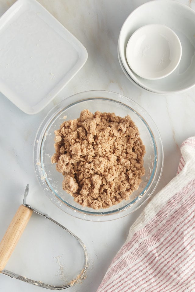 overhead view of mixed crumb topping in a glass mixing bowl