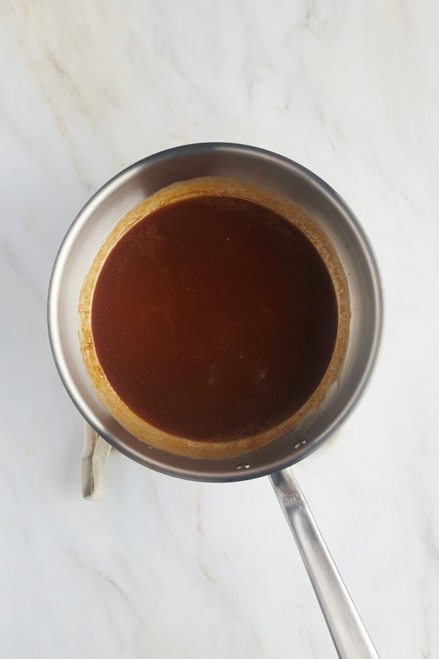 overhead view of caramel sauce in a saucepan