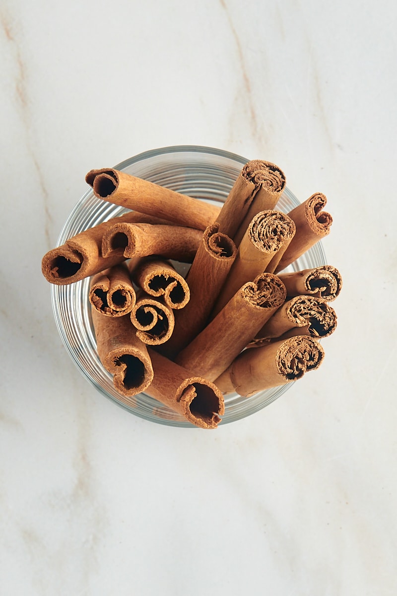 overhead view of cinnamon sticks in a glass
