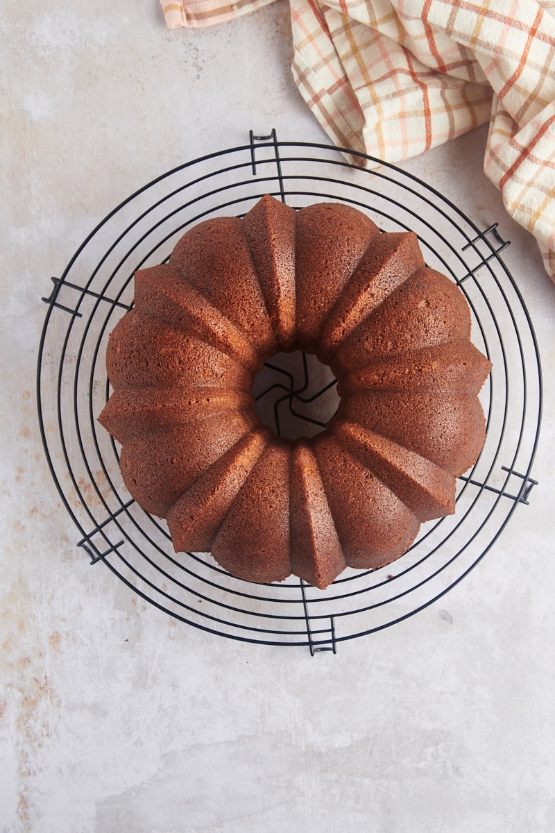 overhead view of Cookie Butter Bundt Cake cooling on a wire rack