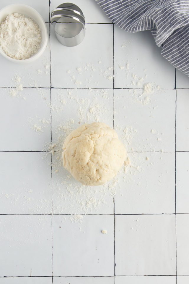 Overhead view of ball of dough on countertop