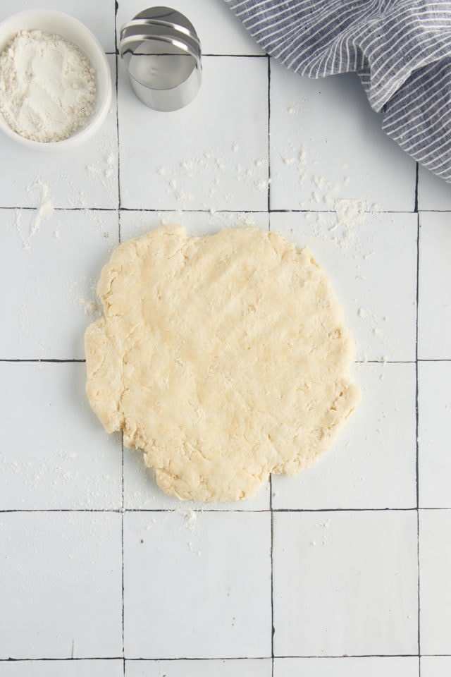 Overhead view of dough for biscuits on countertop