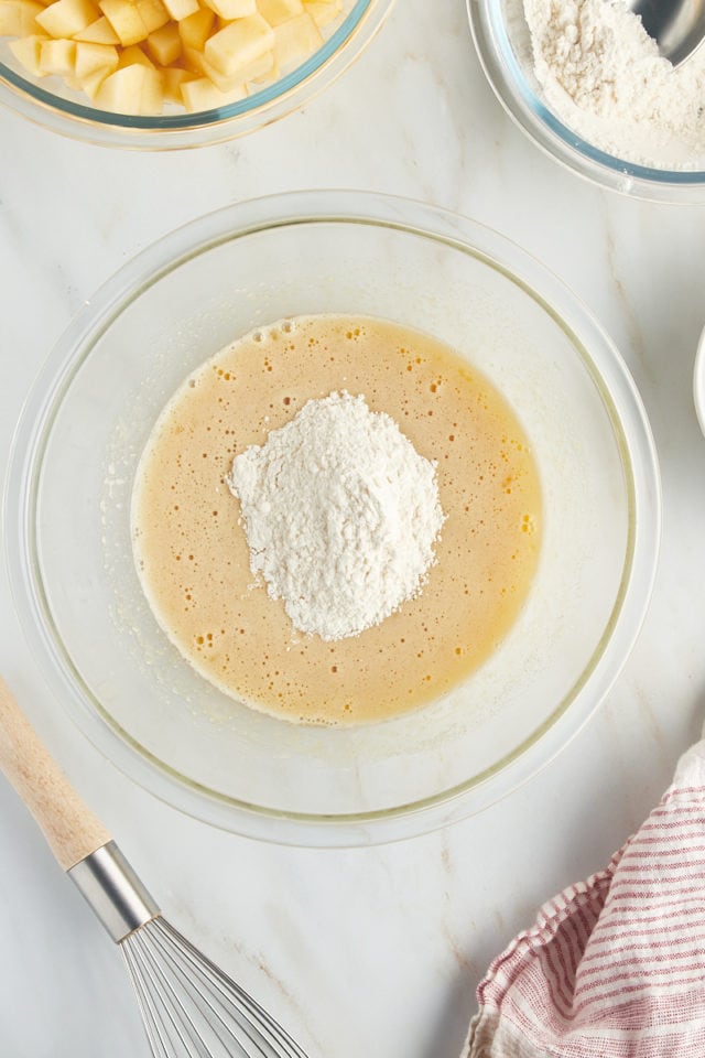 overhead view of dry ingredients added to cake batter