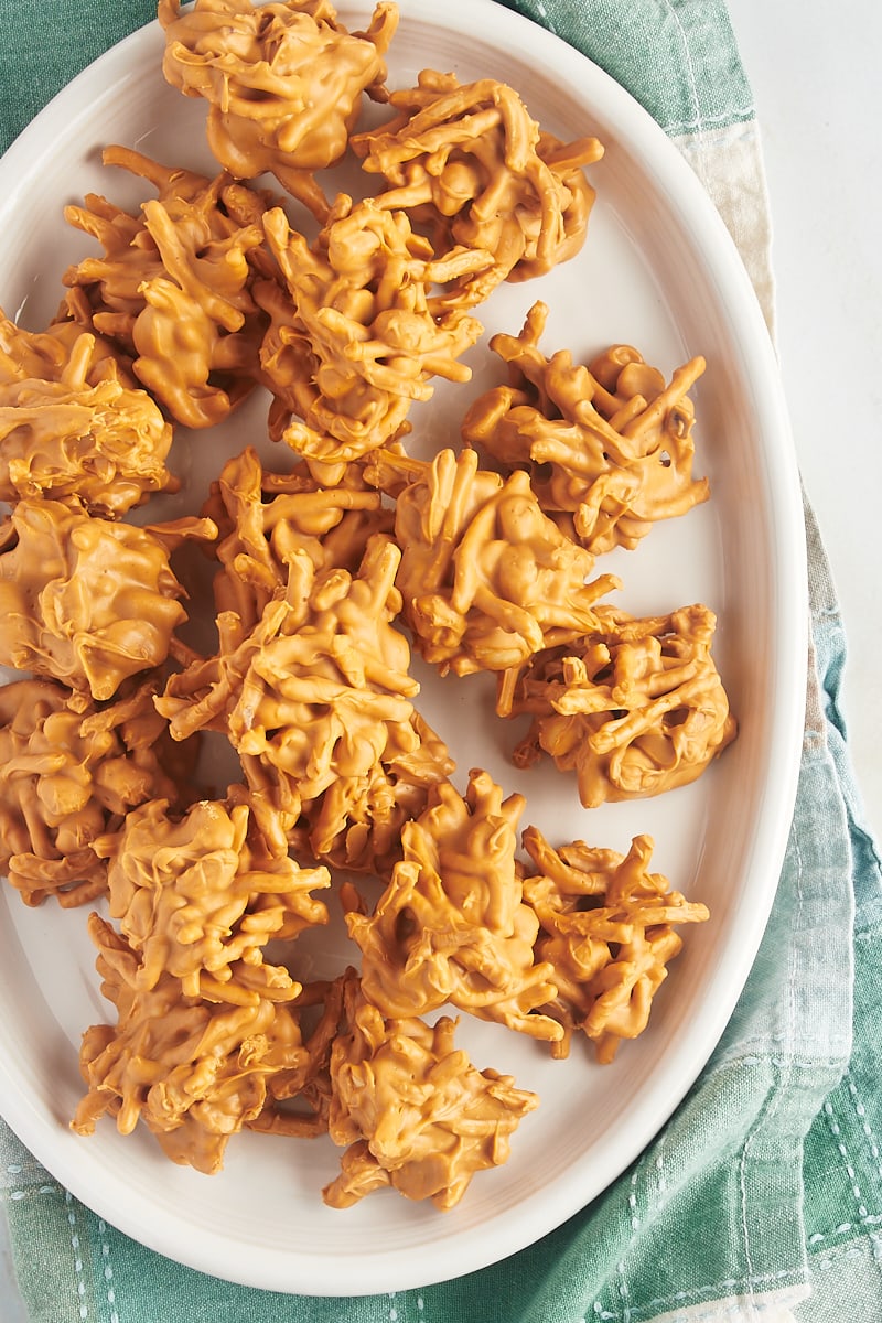overhead view of butterscotch Haystacks on a large white serving plate