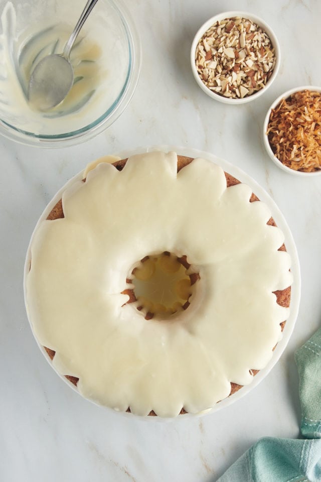 overhead view of glazed Louisiana Crunch Cake on a white cake plate