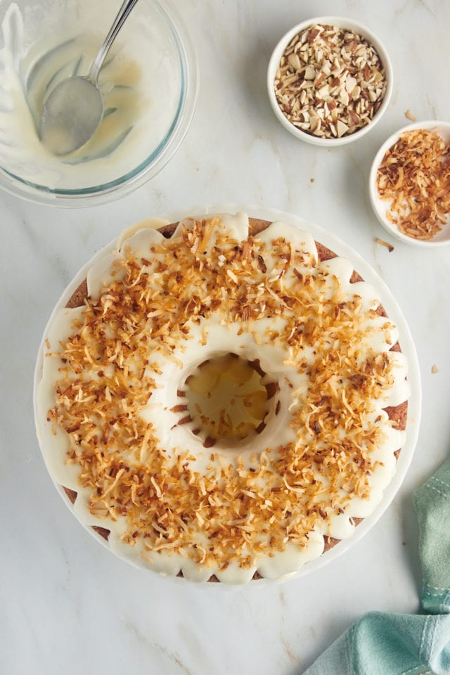 overhead view of Louisiana Crunch Cake topped with glaze and toasted coconut