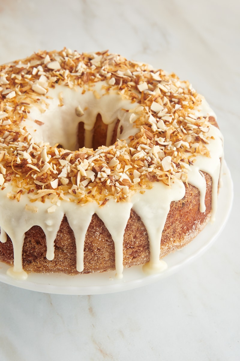 Louisiana Crunch Cake topped with a sweet glaze, toasted coconut, and chopped almonds