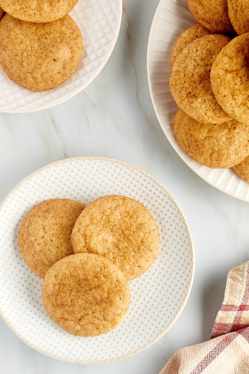 Overhead view of snickerdoodle cookies on 3 plates.