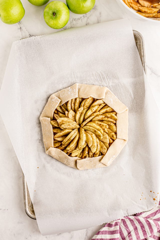 overhead view of apple galette with the crust partially folded over the filling