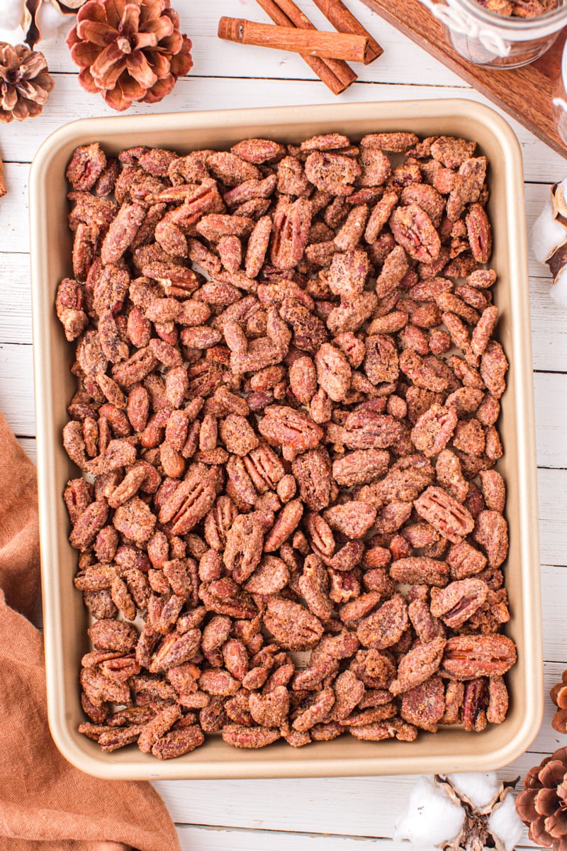 overhead view of candied nuts on a half sheet pan