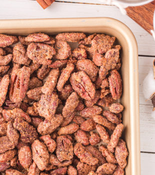 overhead view of candied nuts on a sheet pan