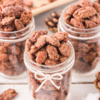three mason jars filled with candied nuts